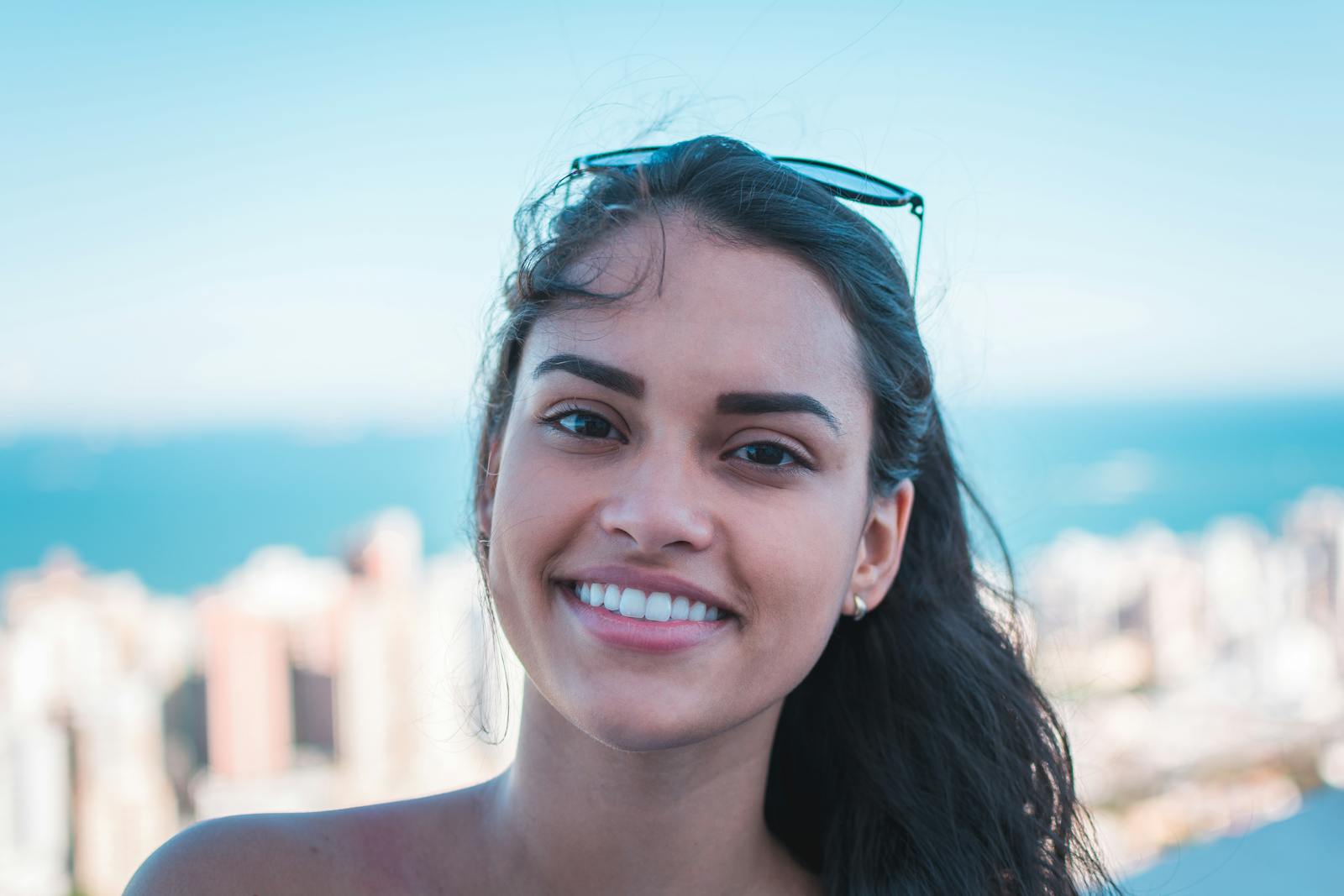 A happy individual person smiling representing the most important relationship with yourself