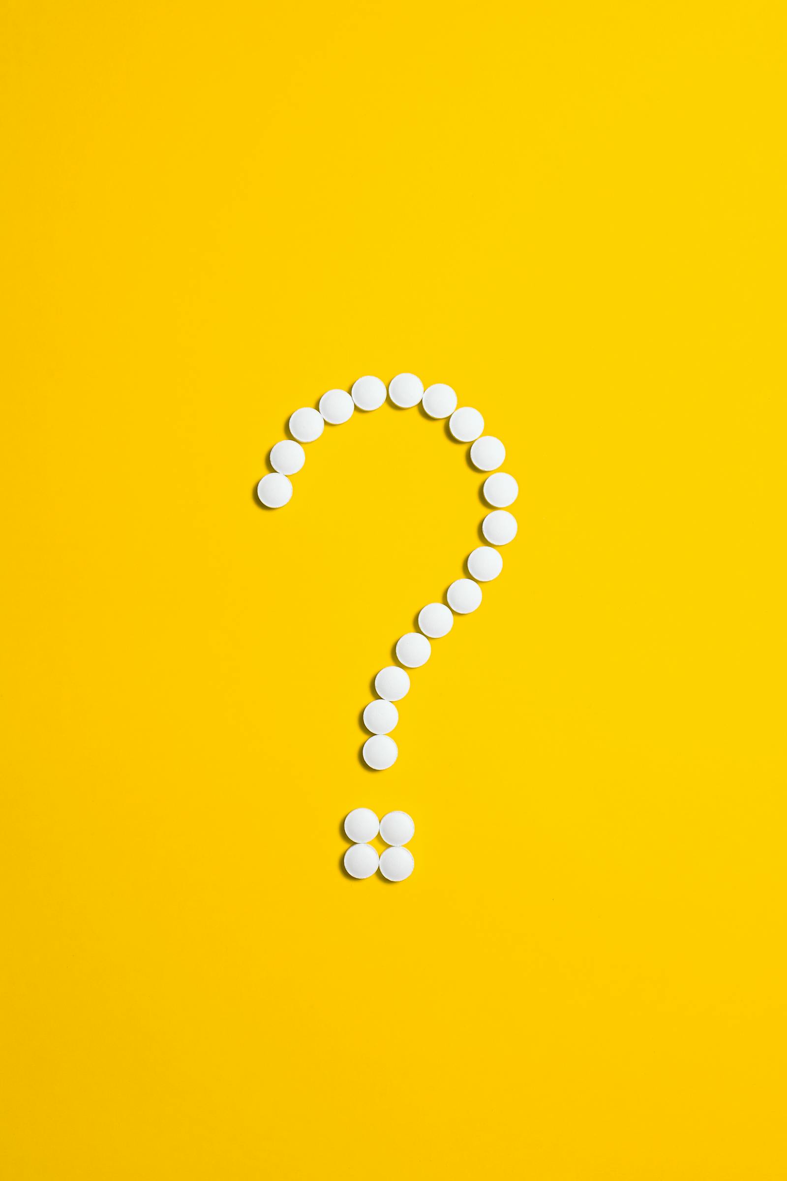 Question mark on yellow background representing questions for personal growth