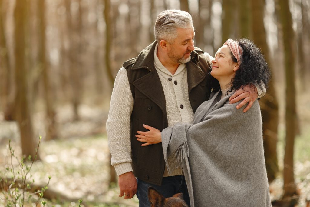 Couple hugging each other warmly in the woods. Enhance Your Well-Being and Quality of Life