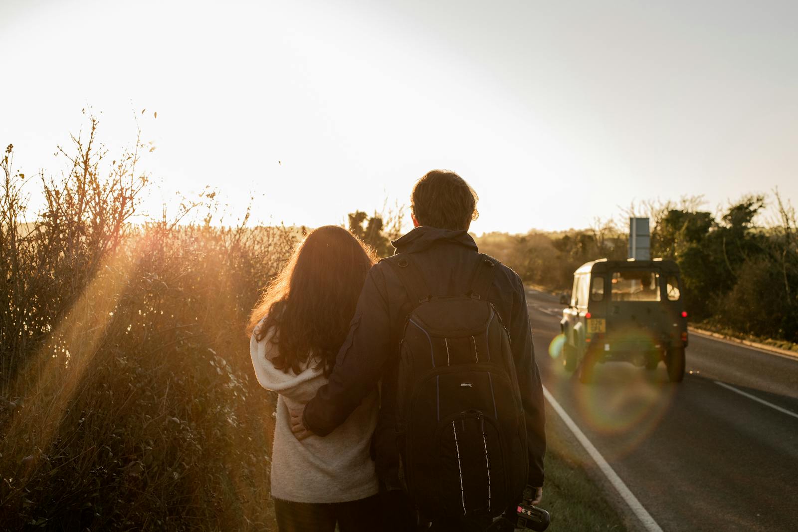 couple walking beside road at sunset challenging relationship myths