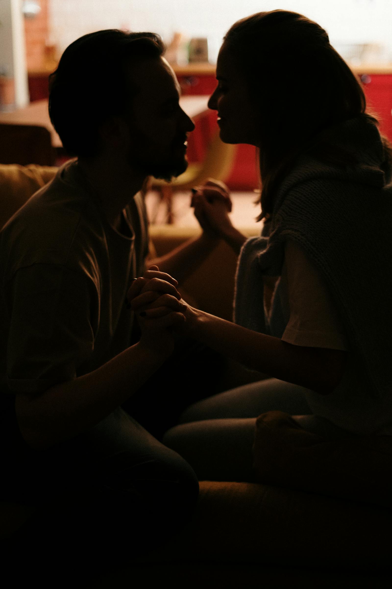 Couple holding hands close intimate bond
