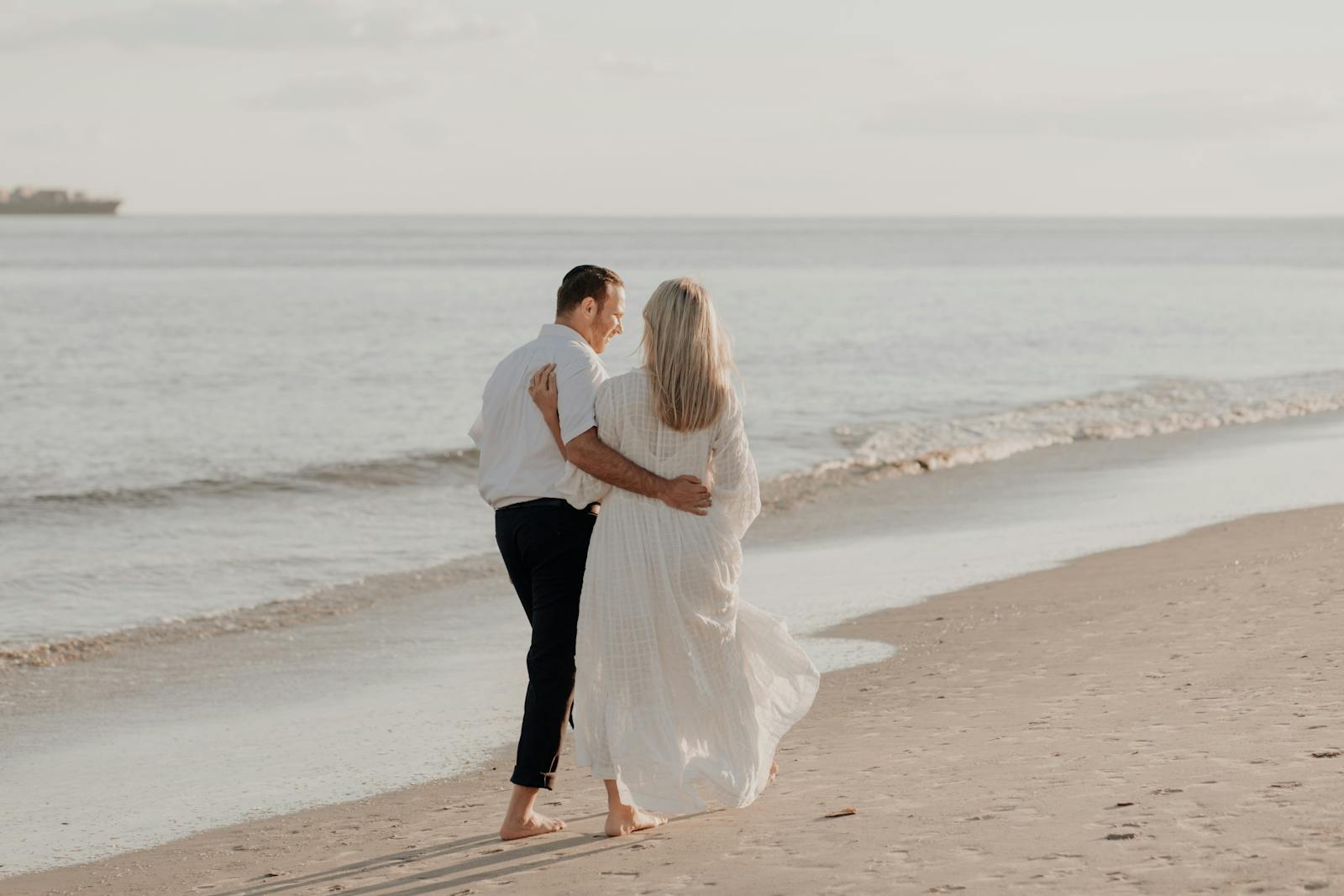 couple walking freely together on beach finding freedom in relationship