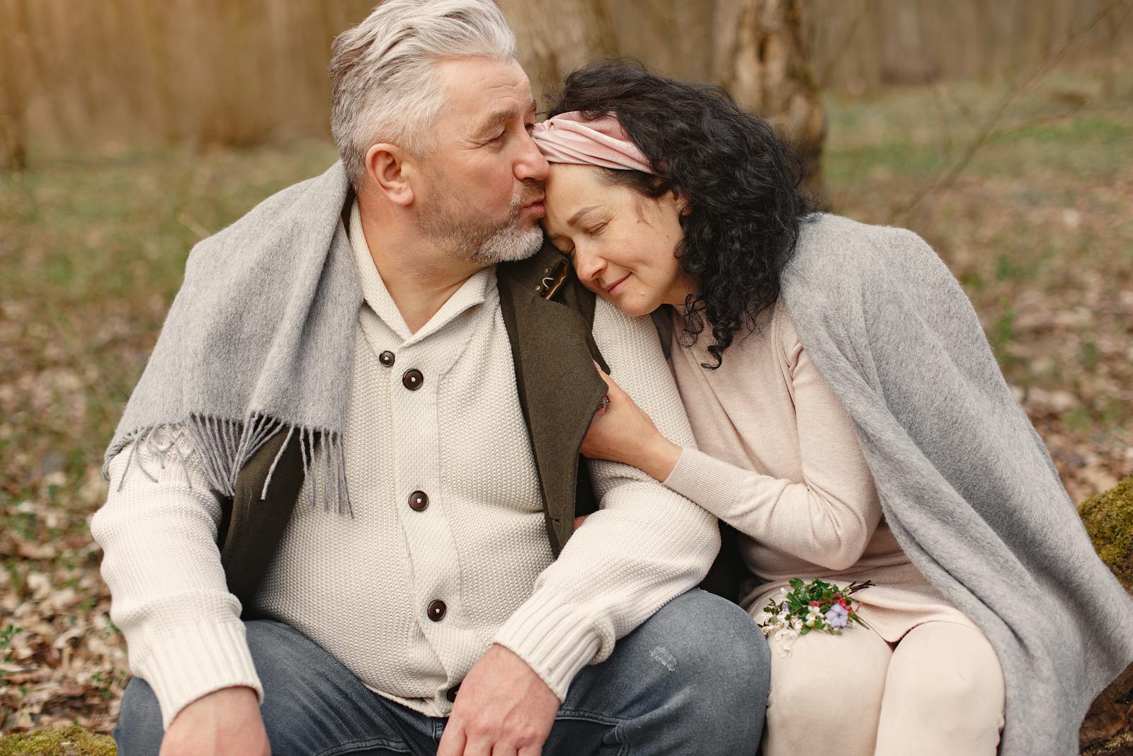 senior couple hugging in autumn park sharing 27 lessons from marriage