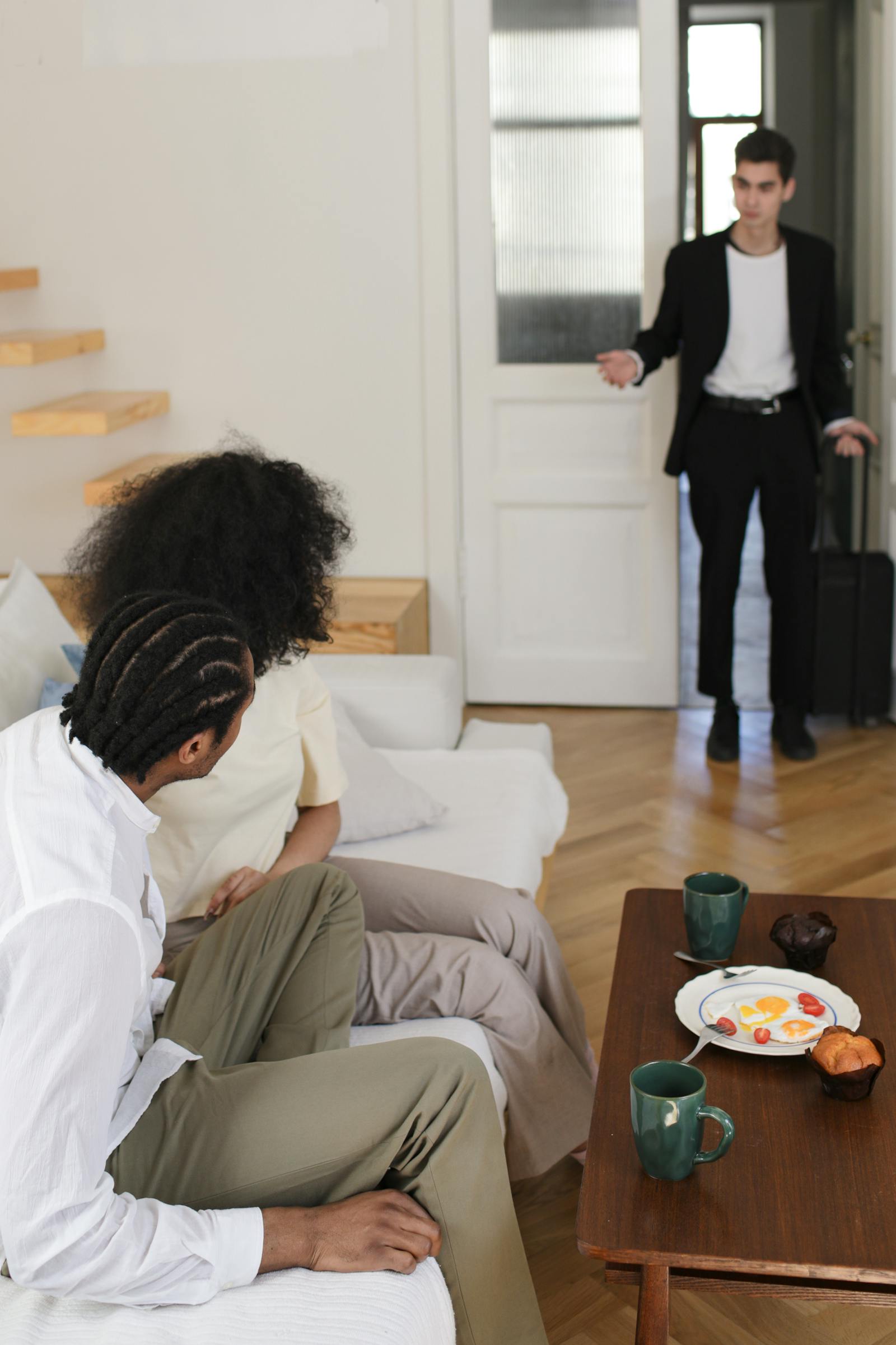couple sitting silently on couch when marriage feels dead