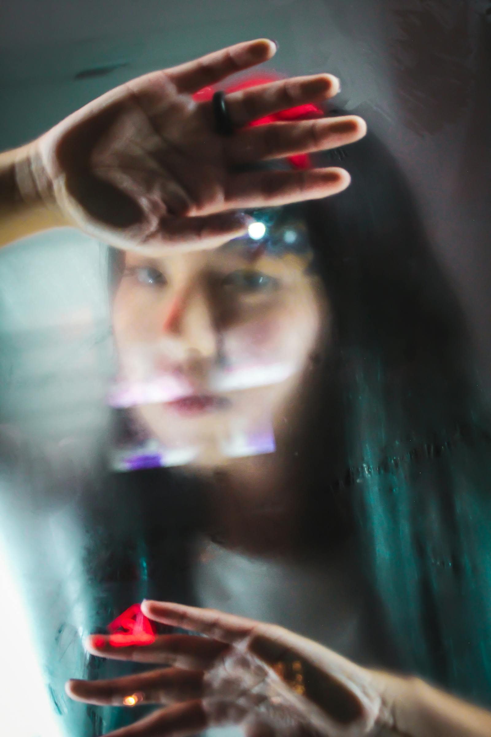 thoughtful woman looking through window contemplating why women opt out of marriage