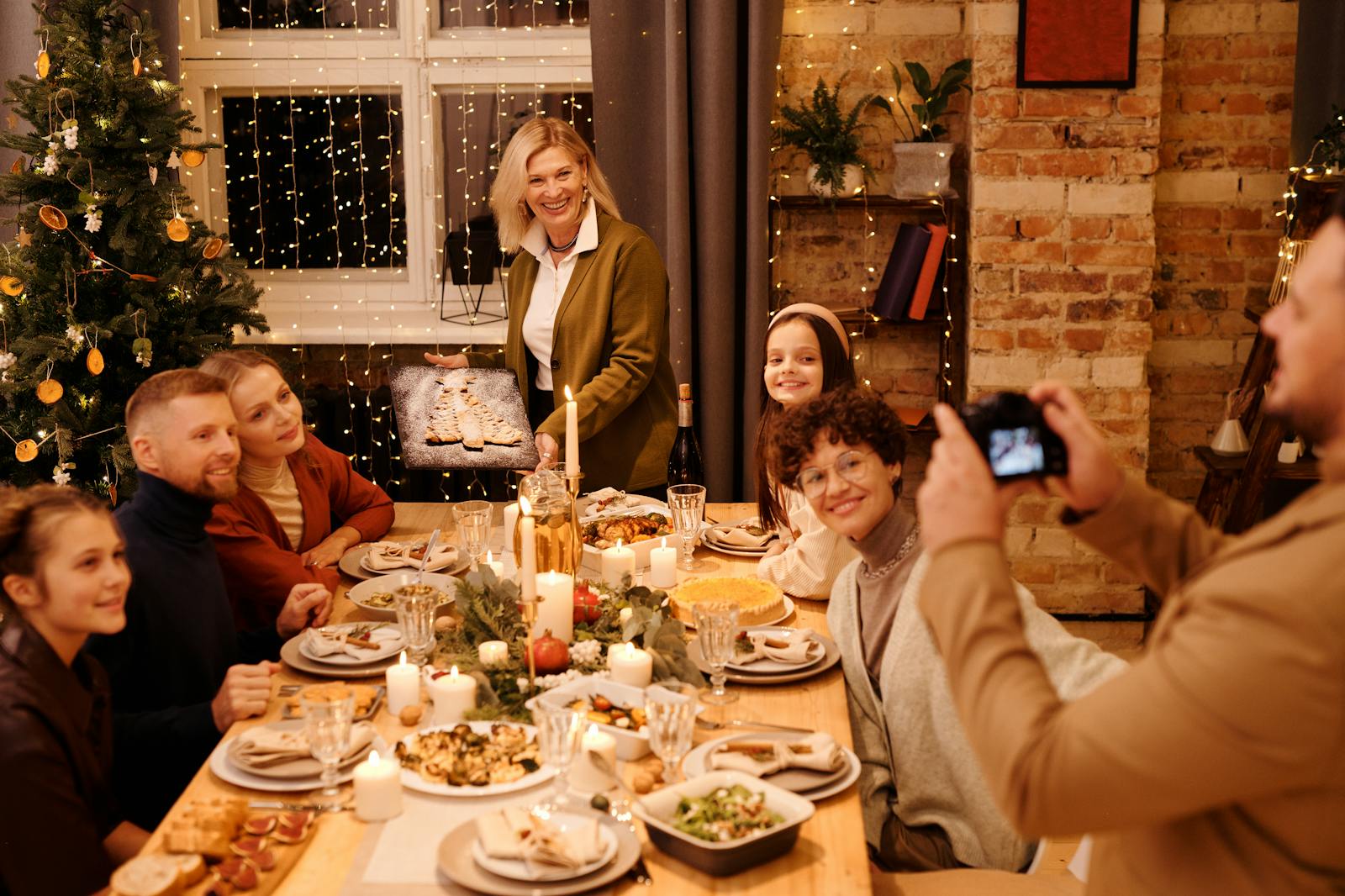 family celebrating Christmas dinner why holiday gatherings cause fights