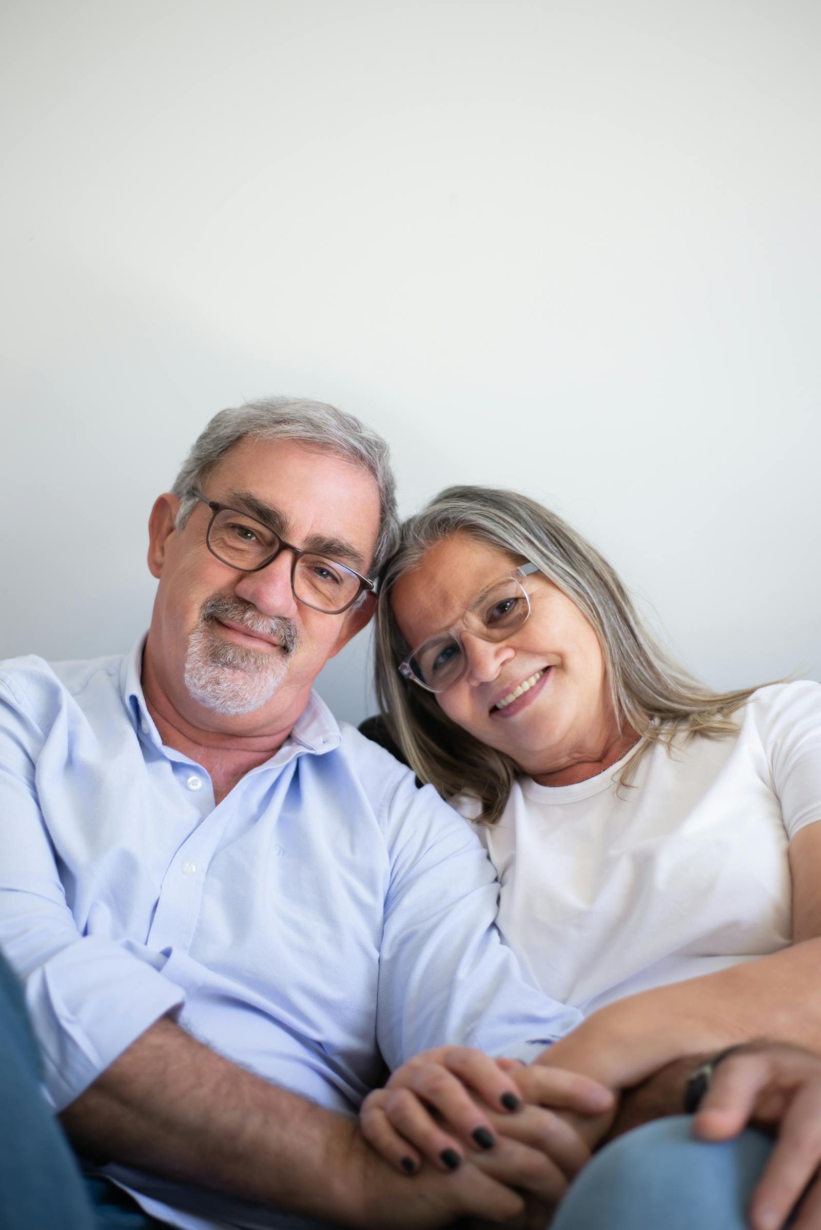 elderly couple smiling together warmly sharing birthday wishes